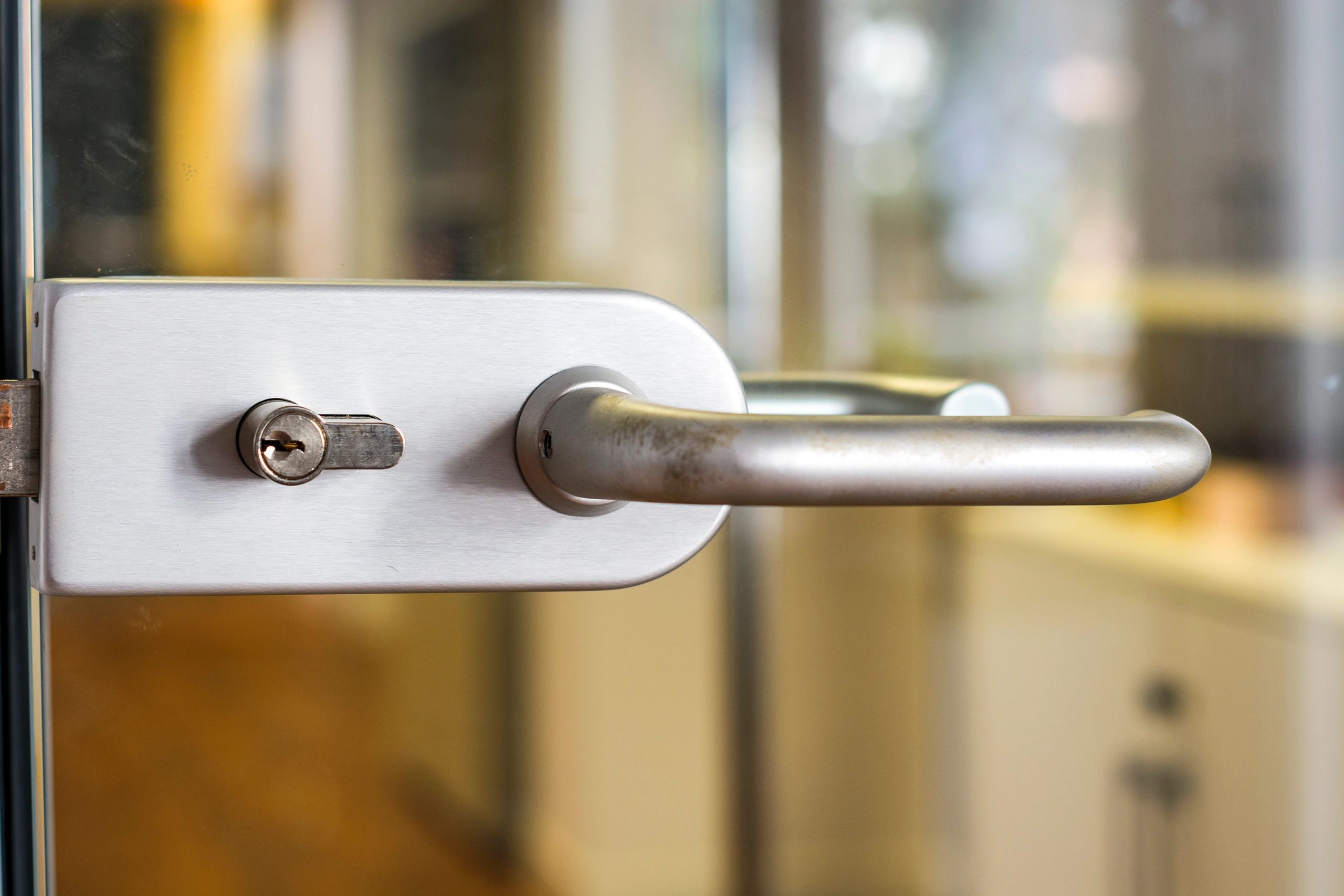Contemporary handle and lock on a commercial glass door