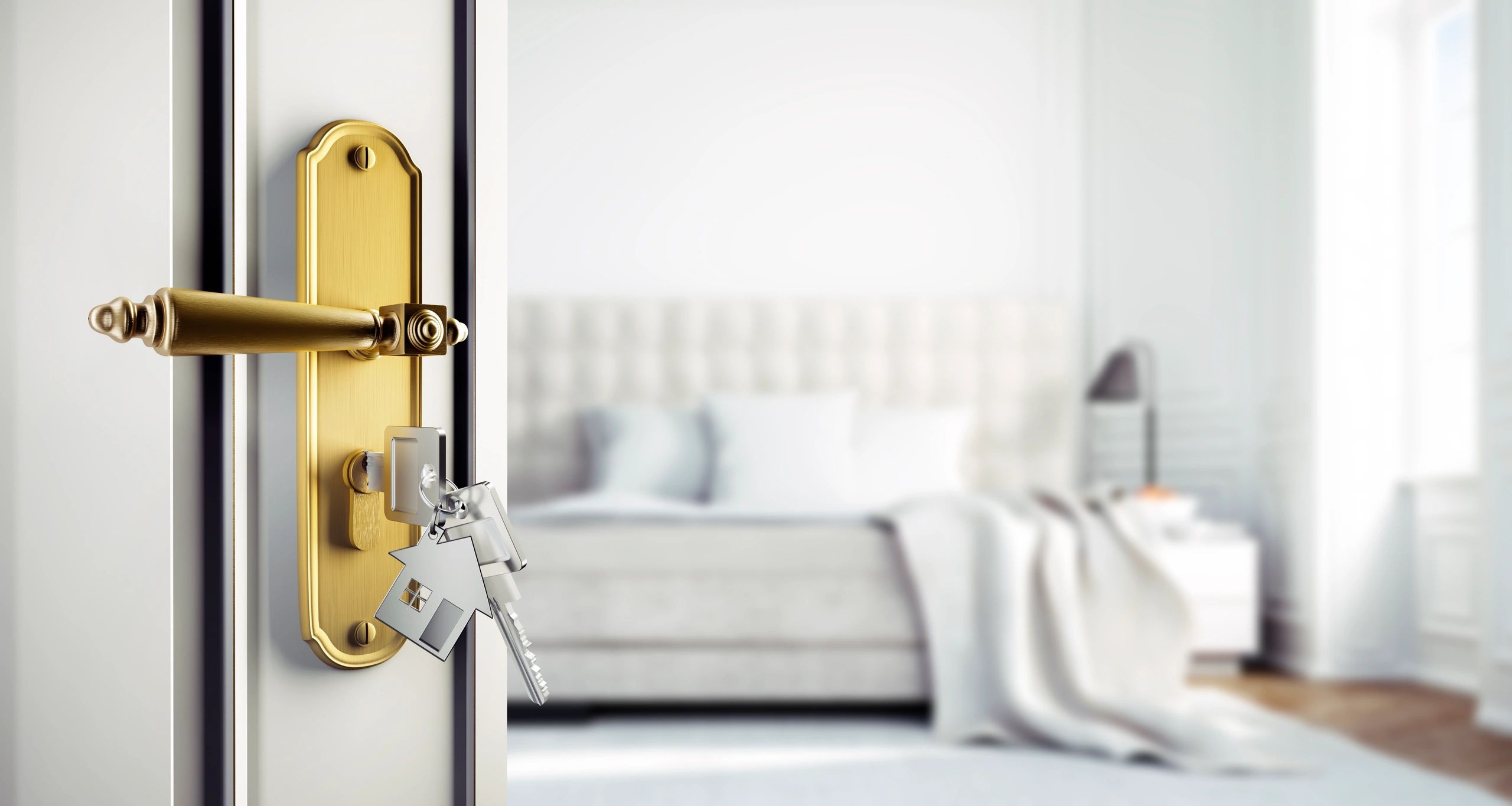 Open residential door with key in lock
