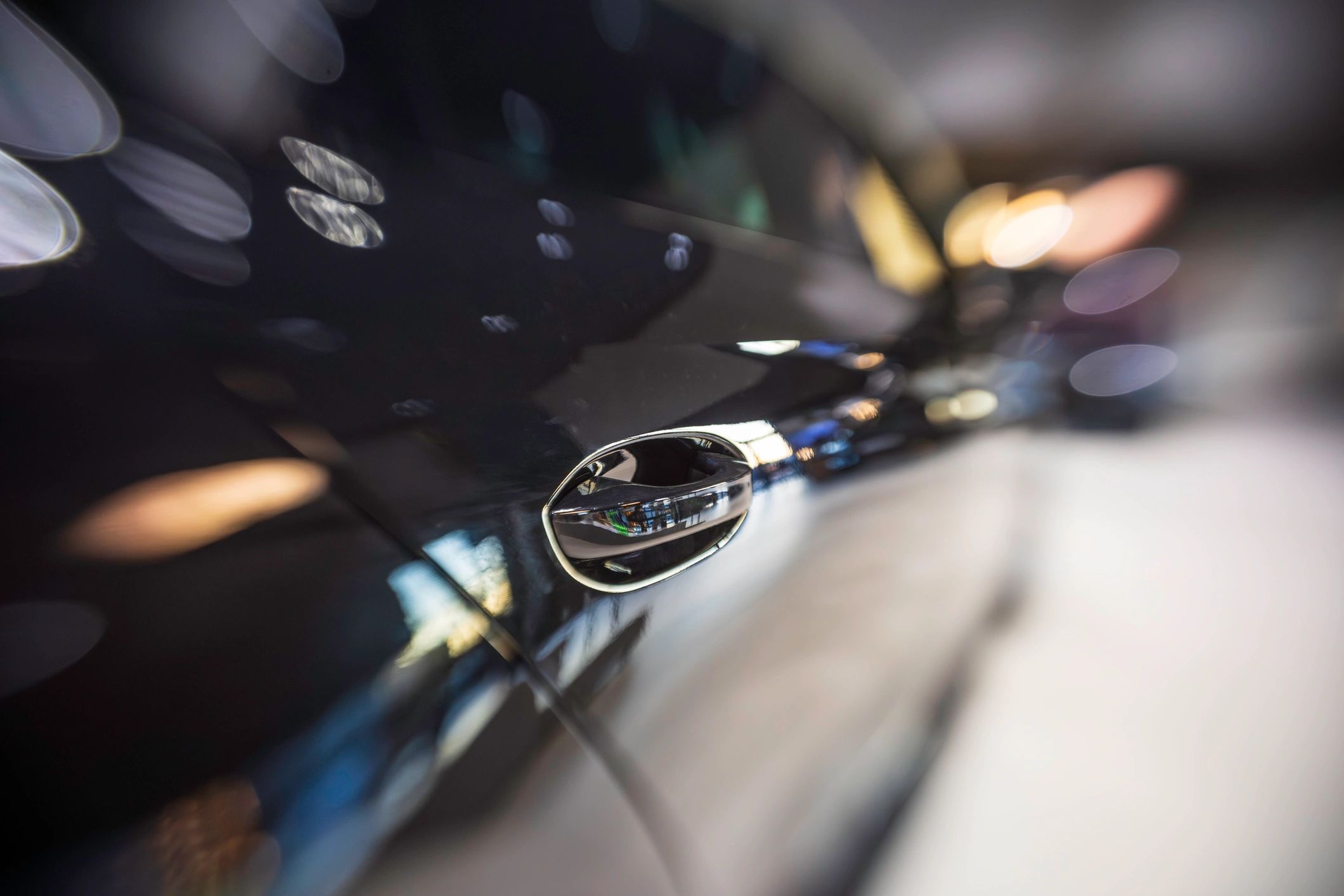 Close-up of a modern car door handle for automotive locksmith service
